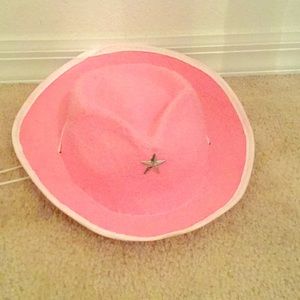 Pink cowgirls play hat